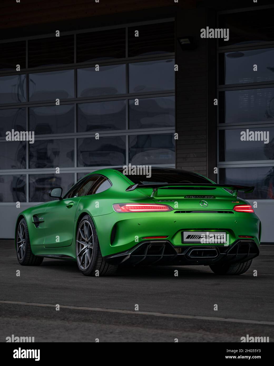 green Mercedes AMG GTR, rear shot, spoiler, exhaust, tail ights Stock Photo