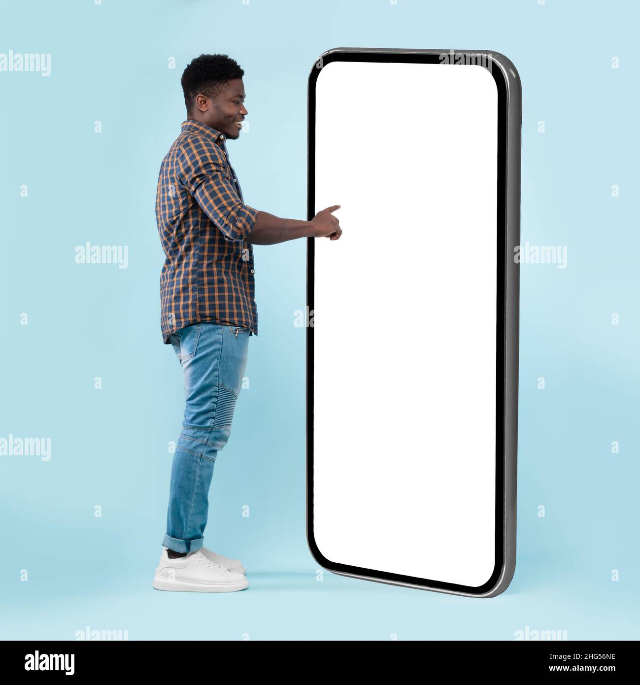 Black guy using white empty smartphone screen panel Stock Photo