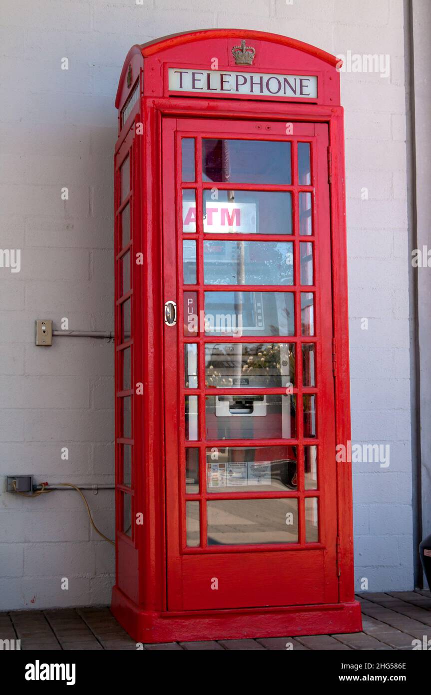 British phone booth converted to ATM station Stock Photo