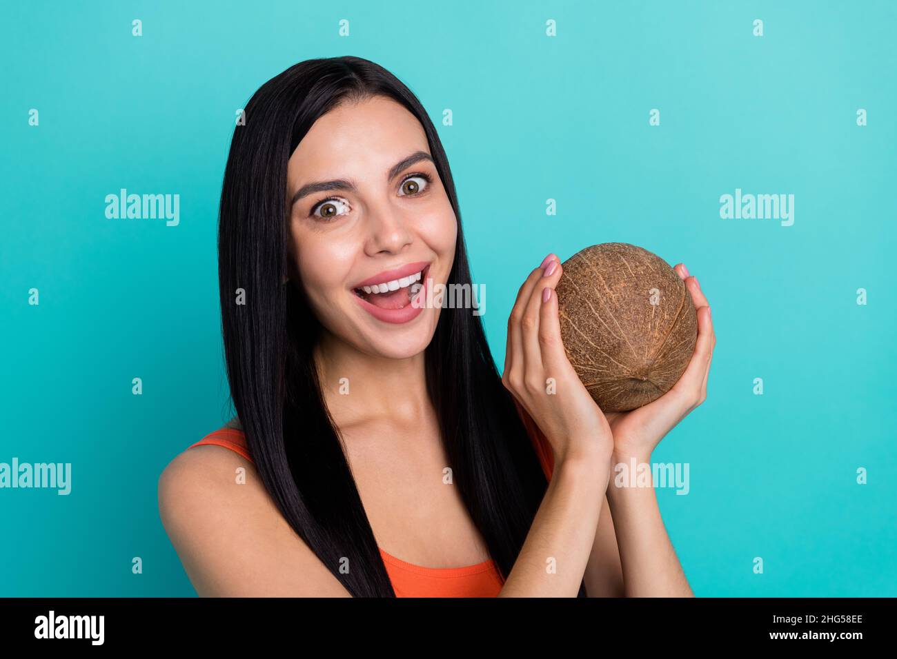 Portrait of positive lady hold big coco nut enjoy milkshake ingredient ...
