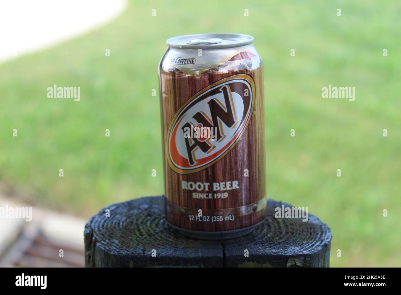 Found this random pop can sitting on the fence at McNeely Lake Stock Photo