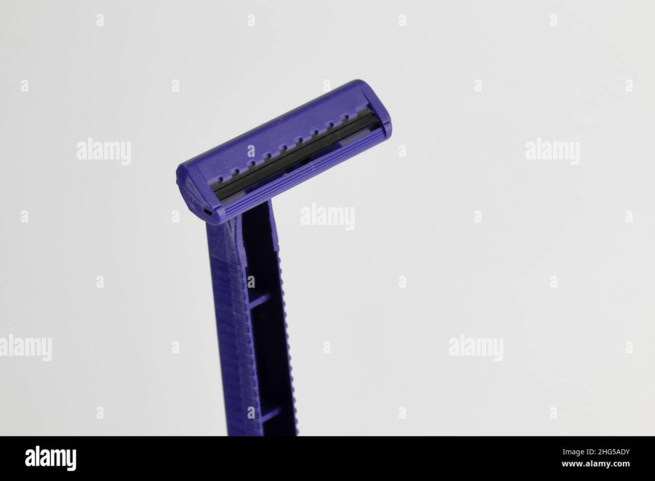 Close up, Front side of double blade with lubricant strip shaver or razor for shaving isolated on white background Stock Photo