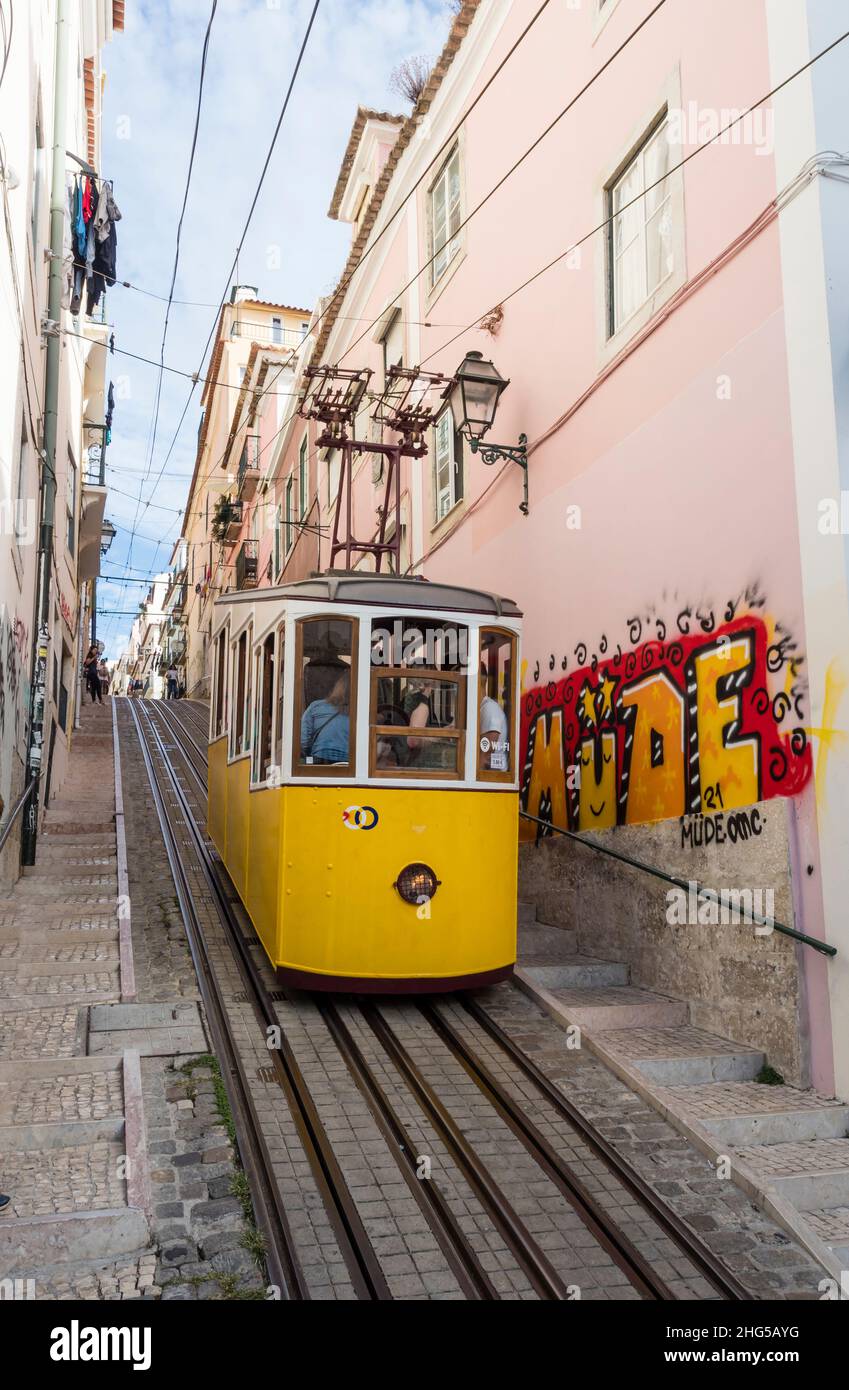 A cablecar of Lisbon's Elevador da Bica that connects the city's Bairro Alto with the Chiado quarter below. Stock Photo