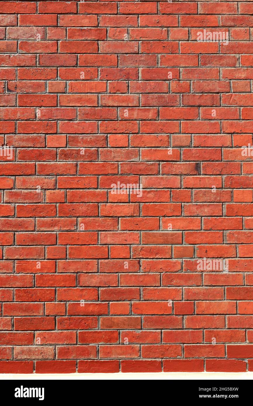 red shiny brick wall, wide panorama of masonry, bricklaying Stock Photo