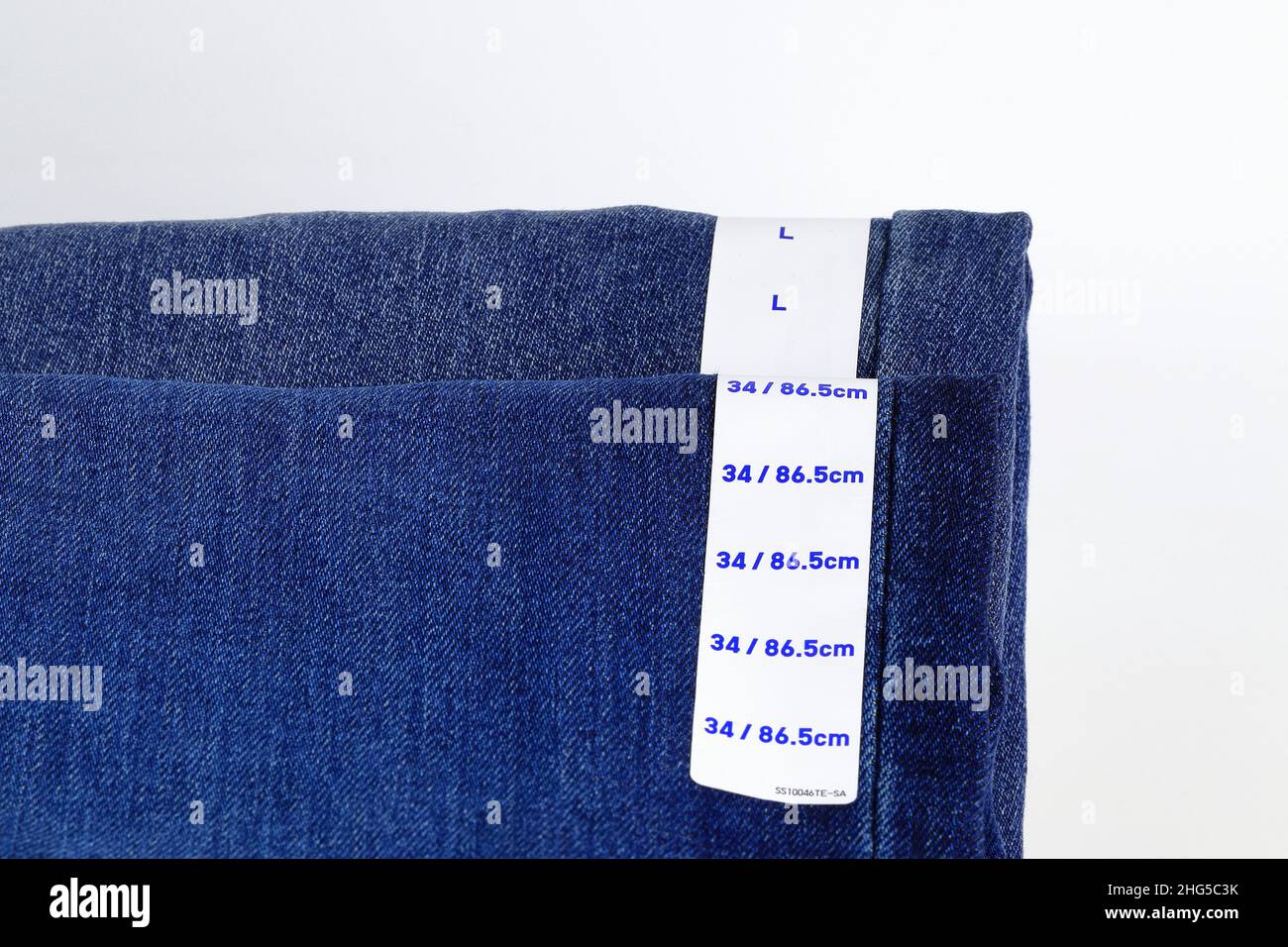 Blue jeans denim with label size, collection jeans stacked with label ...
