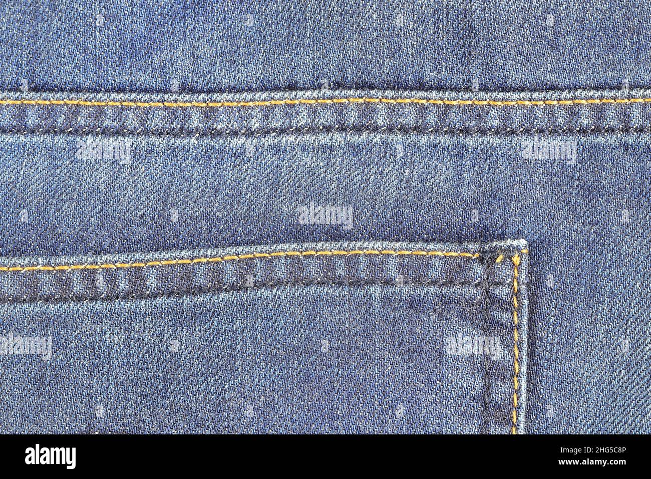 Detail of Back pocket of denim Jeans, Blue Jeans texture vintage background. Stock Photo