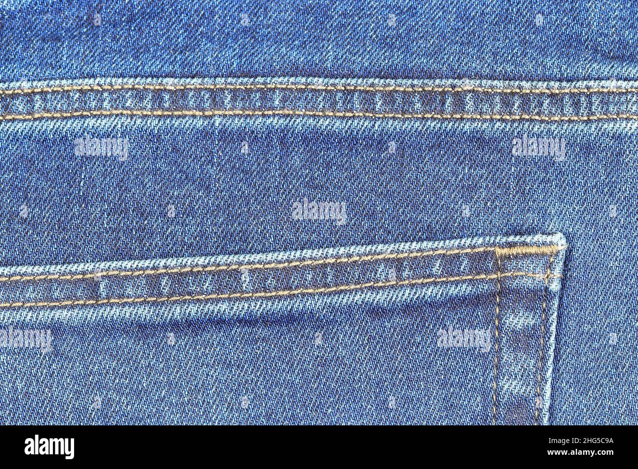 Detail of Back pocket of denim Jeans, Blue Jeans texture vintage background. Stock Photo