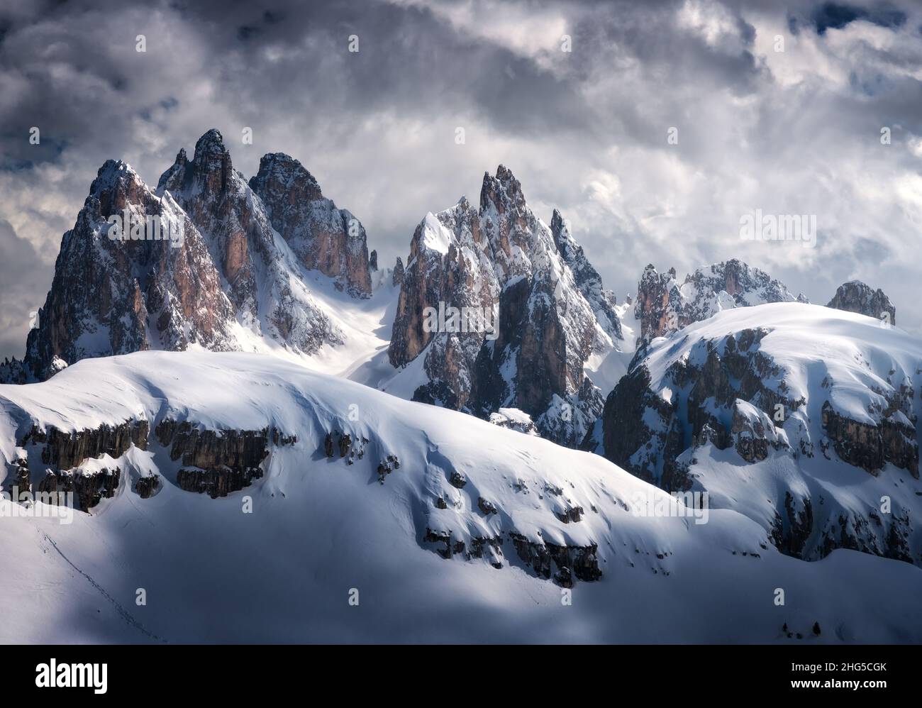 Beautiful mountain peaks in snow in winter. Dramatic landscape Stock Photo