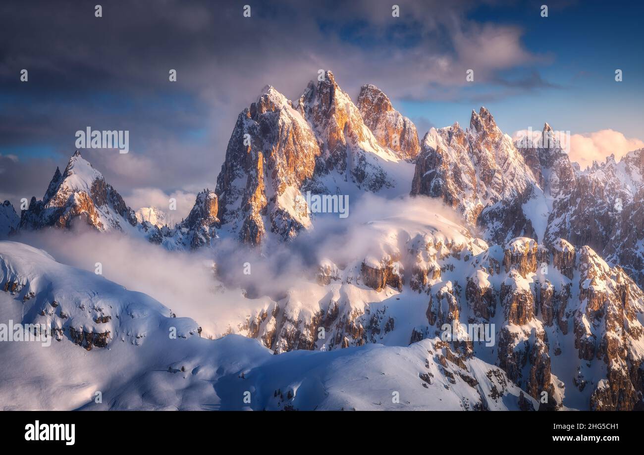 Beautiful mountain peaks in snow in winter at sunset Stock Photo