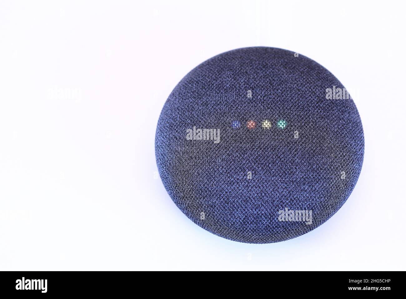 iot device, smart home device, smart home speaker device show with startup light status isolate on white background. Digital Assistant concept. Stock Photo