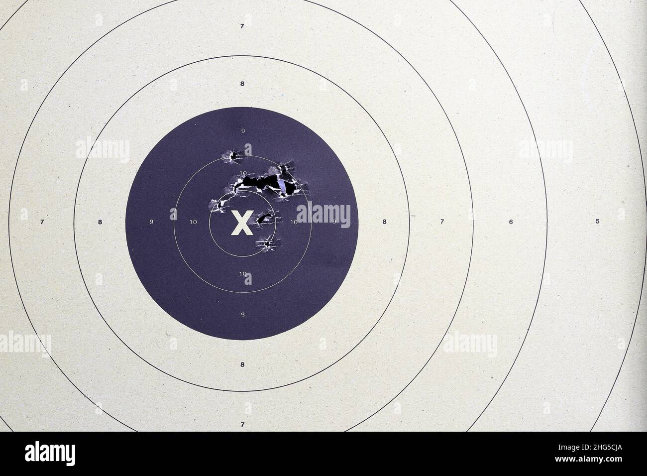 Target Gun With Bullet Holes. Classic Paper Shooting Target. Holes In Target. For Sport, Hunters, Military, Police. circle target accuracy bullet hole. Stock Photo