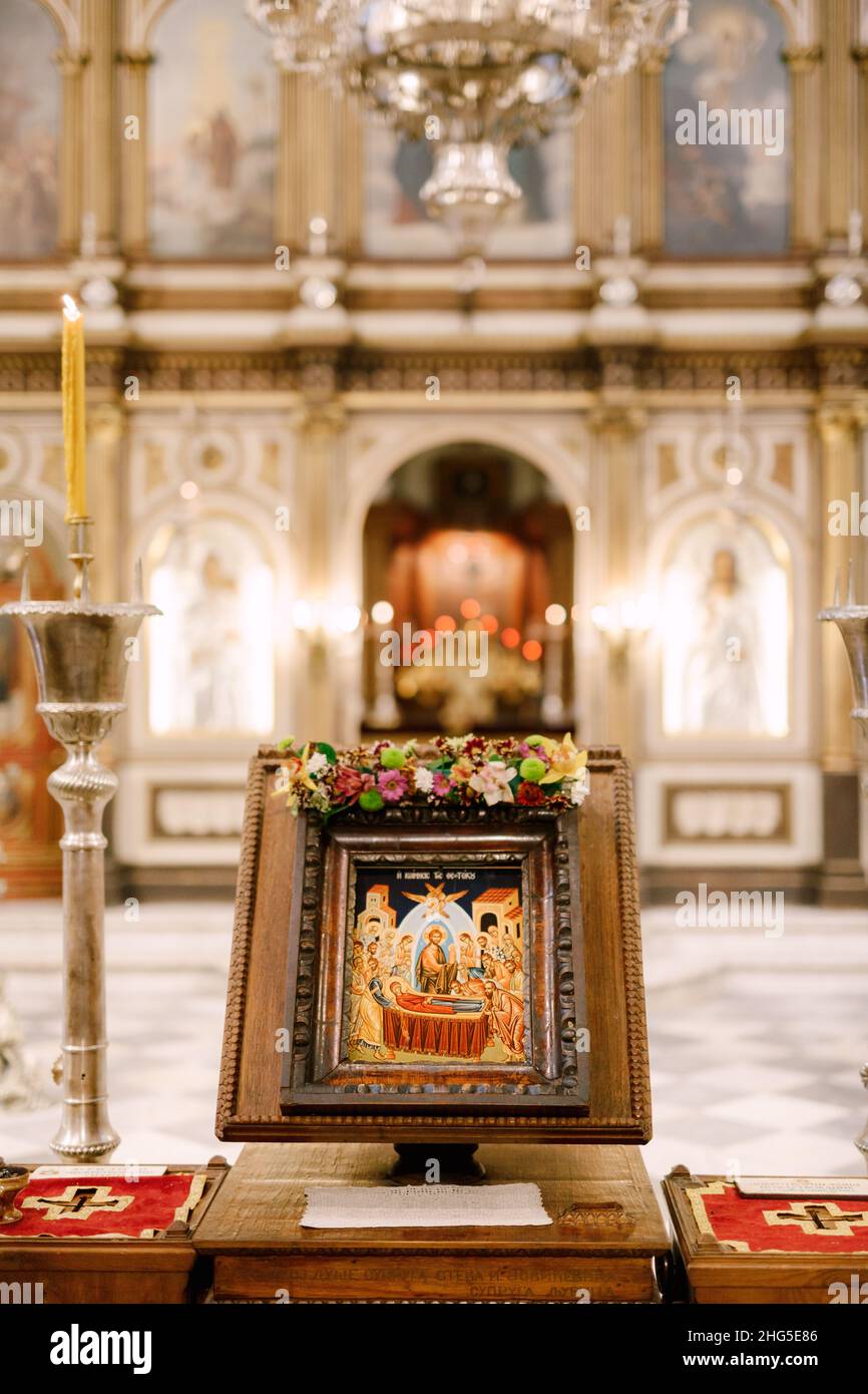 Icon on a stand stands on the table in front of the altar in the Church of St. Sava in Tivat Stock Photo
