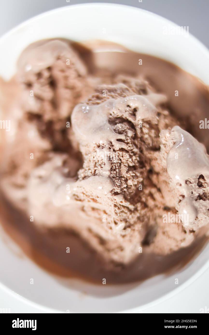 Melting chocolate ice cream in a white ceramic cup Stock Photo Alamy