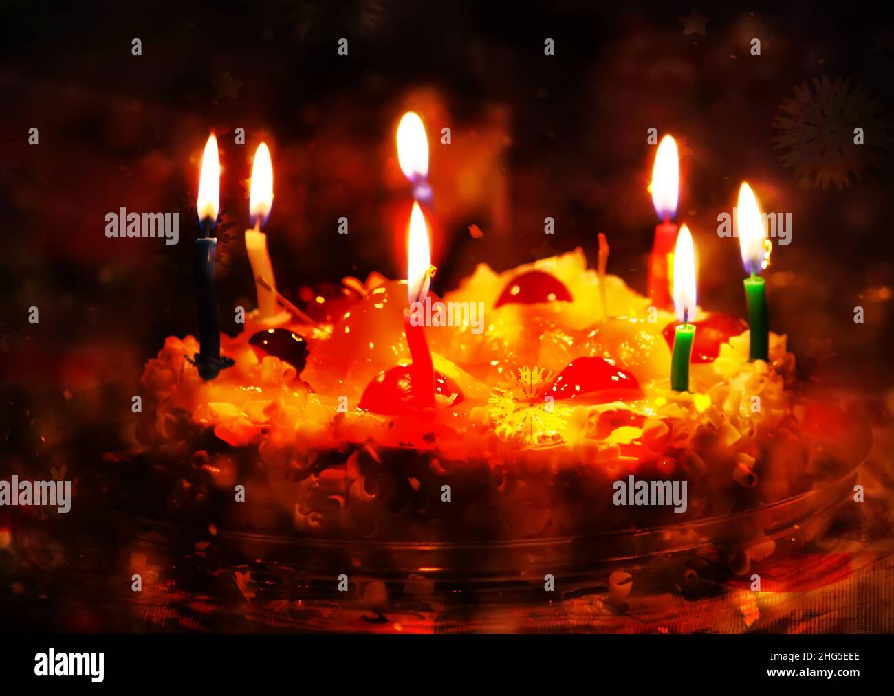 Happy birthday cake with burning colorful candles Stock Photo - Alamy