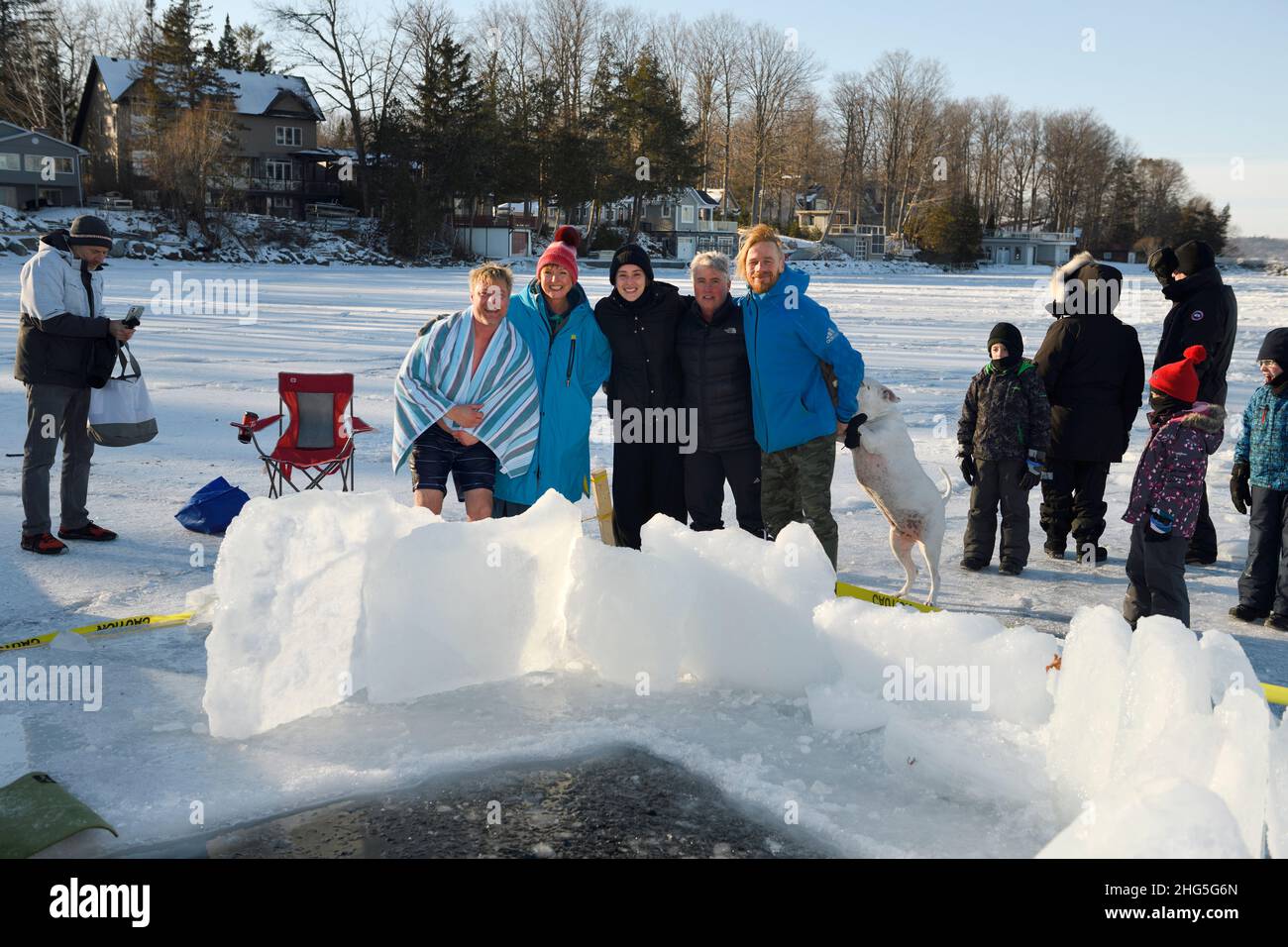 Group shot of ice swimmers after a dip in cold winter water at Kempenfelt Bay Lake Simcoe Barrie Ontario Stock Photo