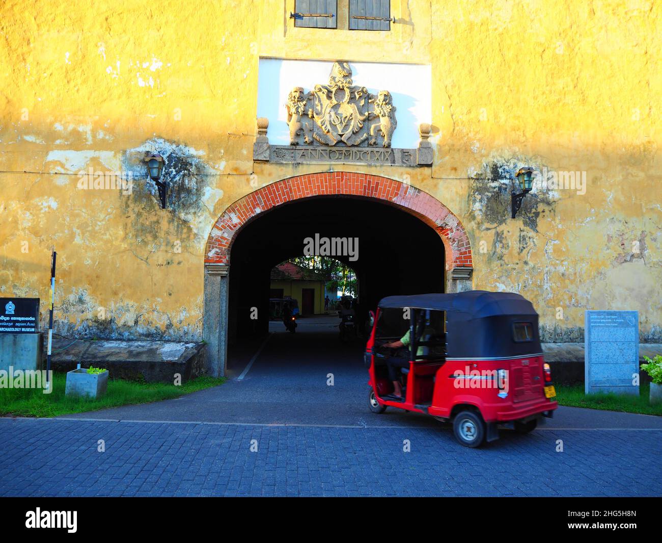 Tuk Tuk entering the main gate of colonial city of Galle, Sri Lanka, Travel again South East Asia  #hinterland #authentic #fernweh #slowtravel Stock Photo