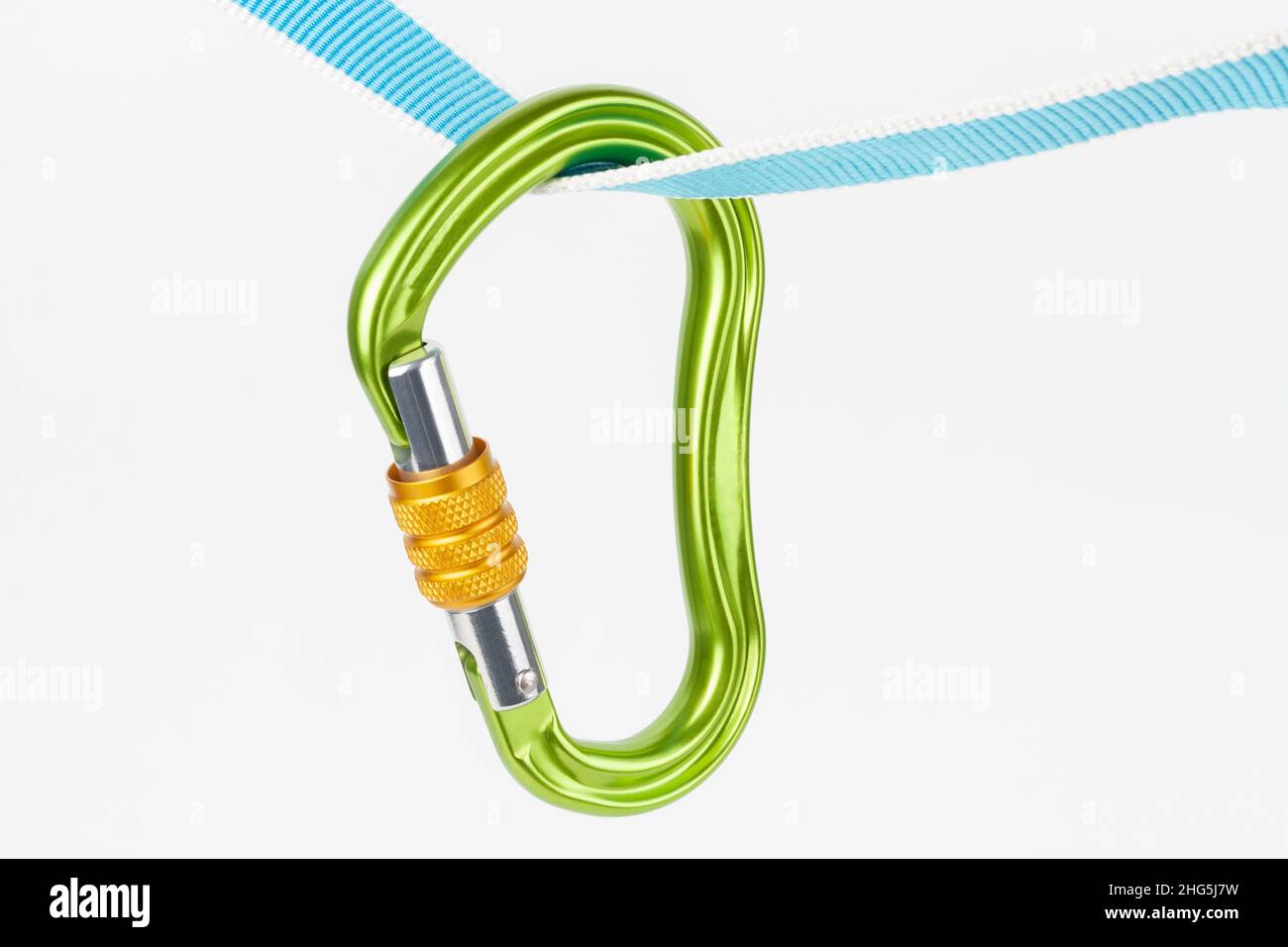 New green HMS carabiner, screw lock snap hook, climbing equipment on ...