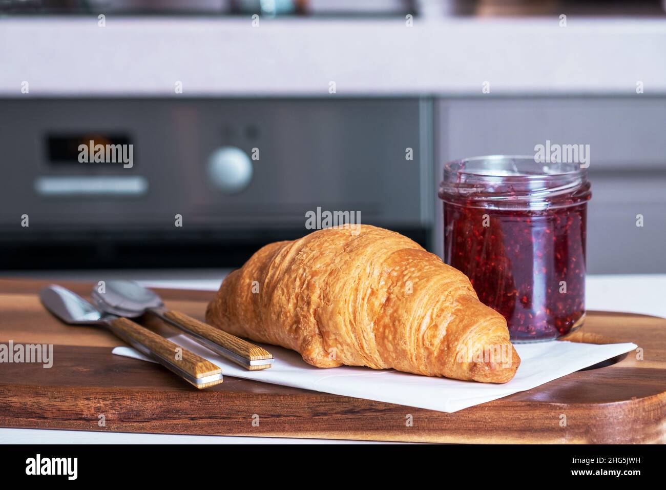 Croissant for breakfast with jam Stock Photo