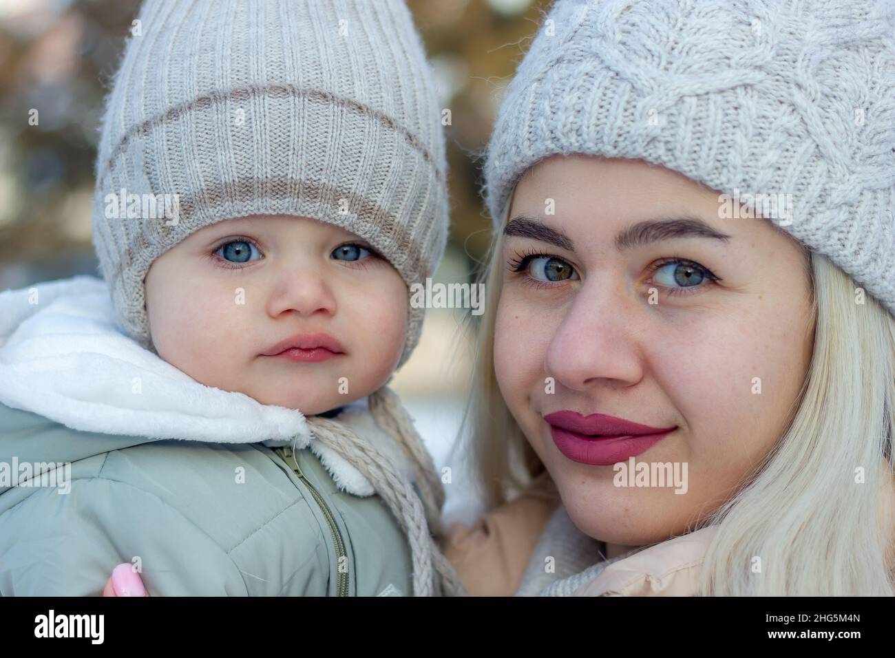 mother and baby boy in winter, parent and child in winter Stock Photo
