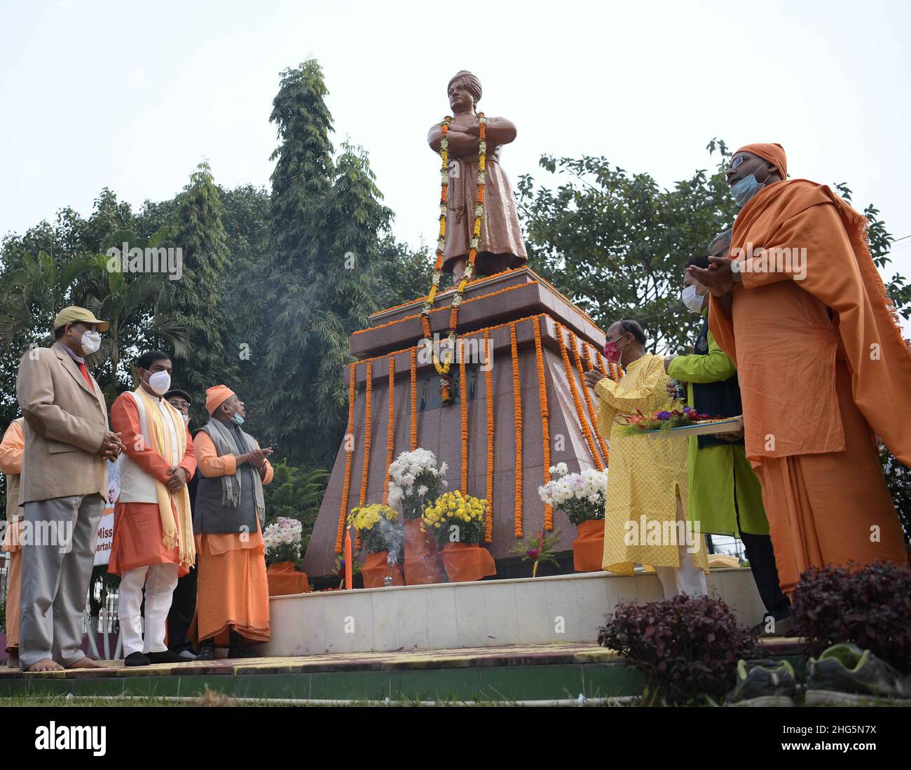 People gathered in front of the statue of Swami Vivekananda during celebration of Vivekananda’s 159th birth anniversary at Agartala. Tripura, India. Stock Photo