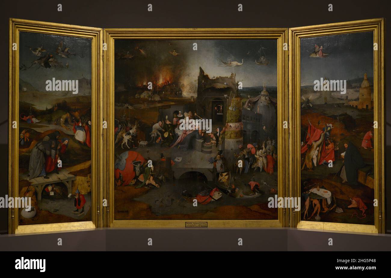 Hieronymus Bosch (1450-1516). Netherlandish painter. Triptych of the Temptations of Saint Anthony, 1498. Fly and Fall of St Anthony (left), The Temptation of St. Athony (center) and Contemplation of St. Anthony (right). National Museum of Ancient Art. Lisbon, Portugal. Stock Photo