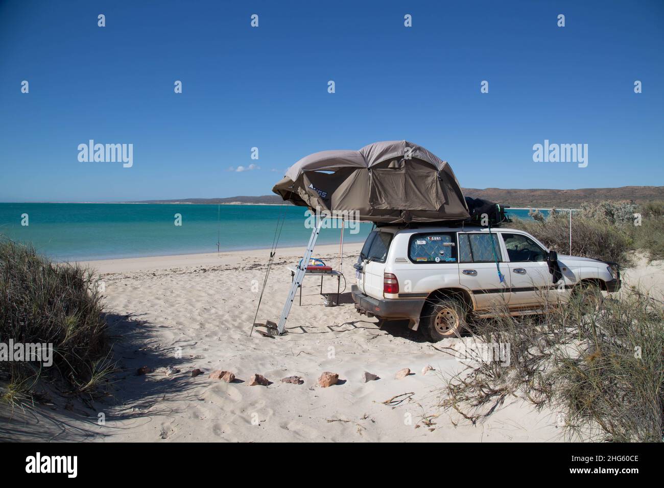 Camping with a rooftoptent on a beach in Australia Stock Photo