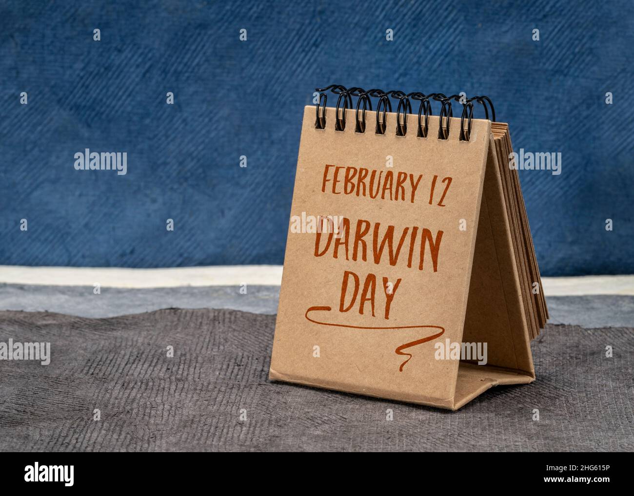 International Darwin Day, February 12 handwriting in a desktop