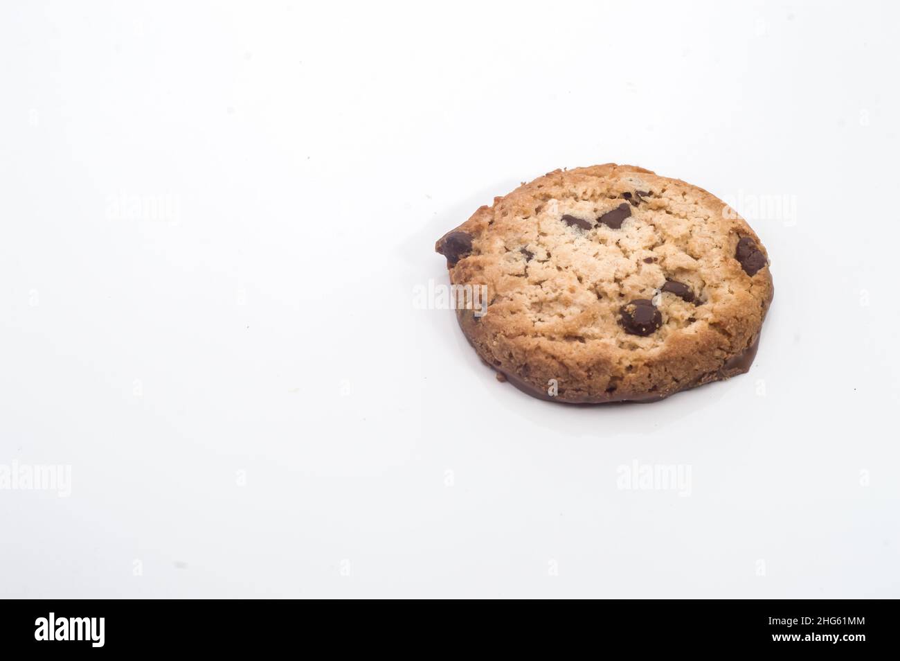 cookies on a plate with blurred cup in the background and falling coffee drops ,copy space Stock Photo