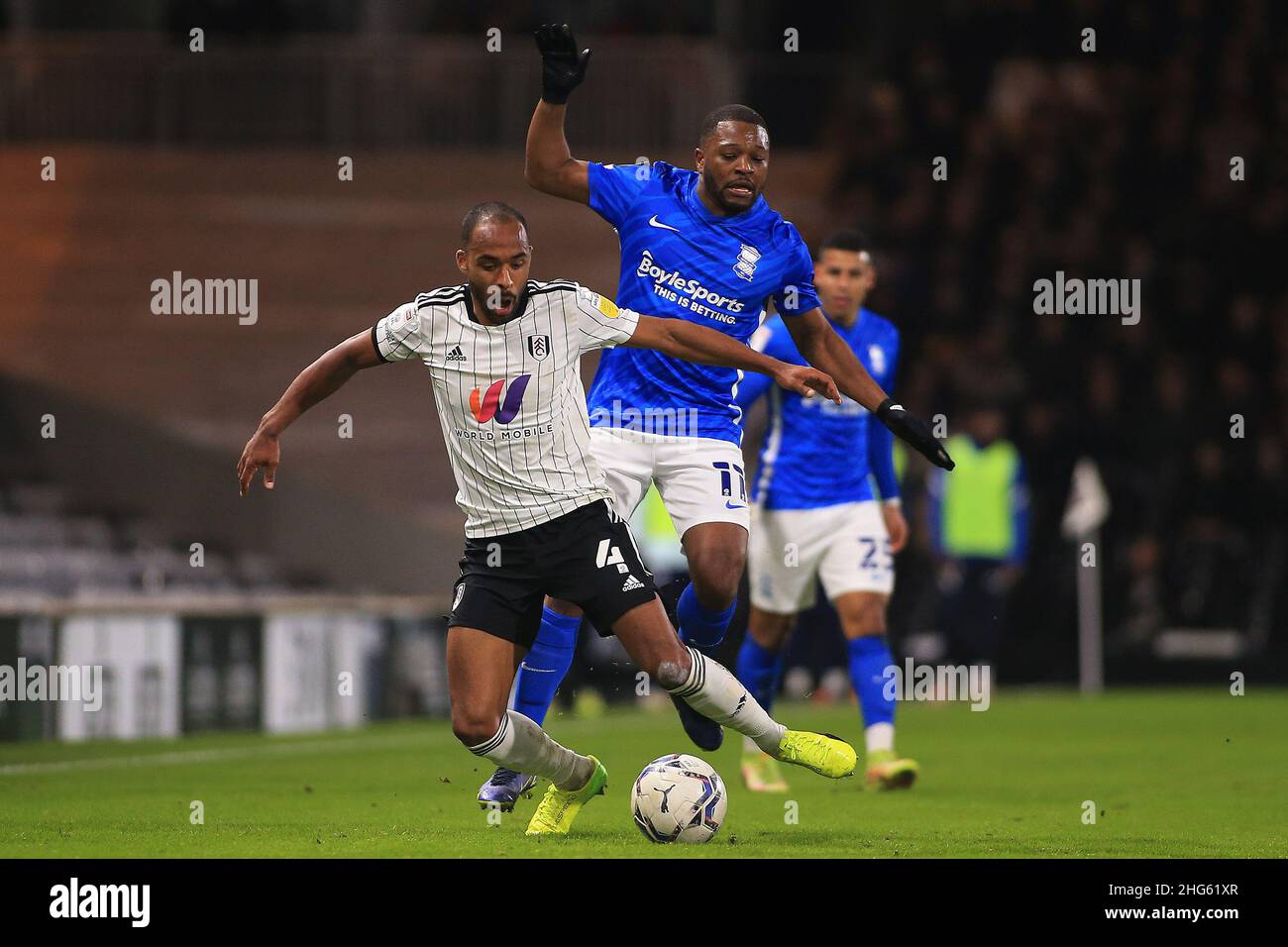 London, UK. 18th Jan, 2022. Denis Odoi of Fulham (L) is fouled by Jeremie Bela of Birmingham City (R). EFL Skybet Championship match, Fulham v Birmingham City at Craven Cottage in London on Tuesday 18th January 2022. this image may only be used for Editorial purposes. Editorial use only, license required for commercial use. No use in betting, games or a single club/league/player publications. pic by Steffan Bowen/Andrew Orchard sports photography/Alamy Live news Credit: Andrew Orchard sports photography/Alamy Live News Stock Photo