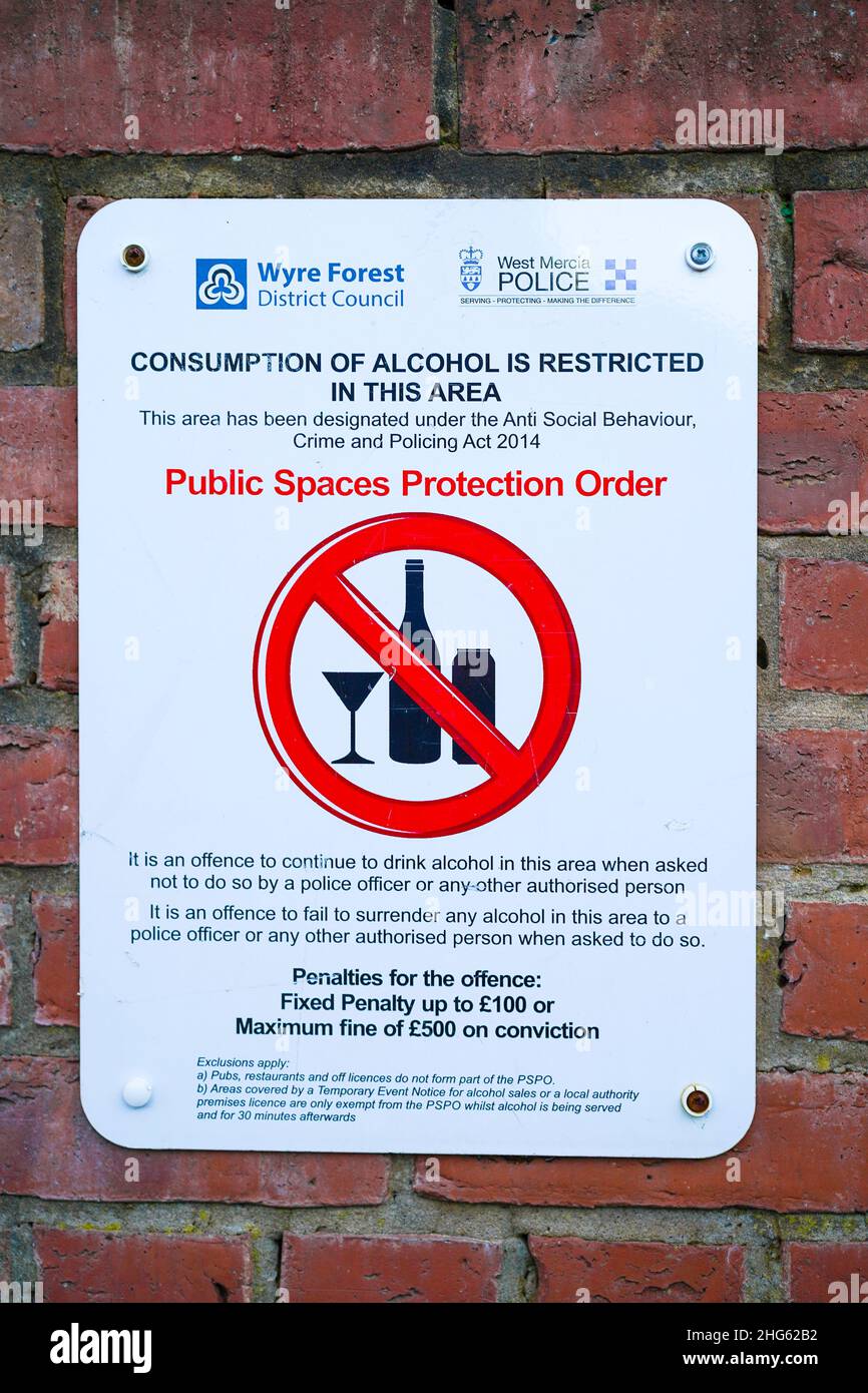 Public Spaces Protection Order notice outdoors on wall, UK. Isolated council & police sign for Alcohol Restricted area. Stock Photo