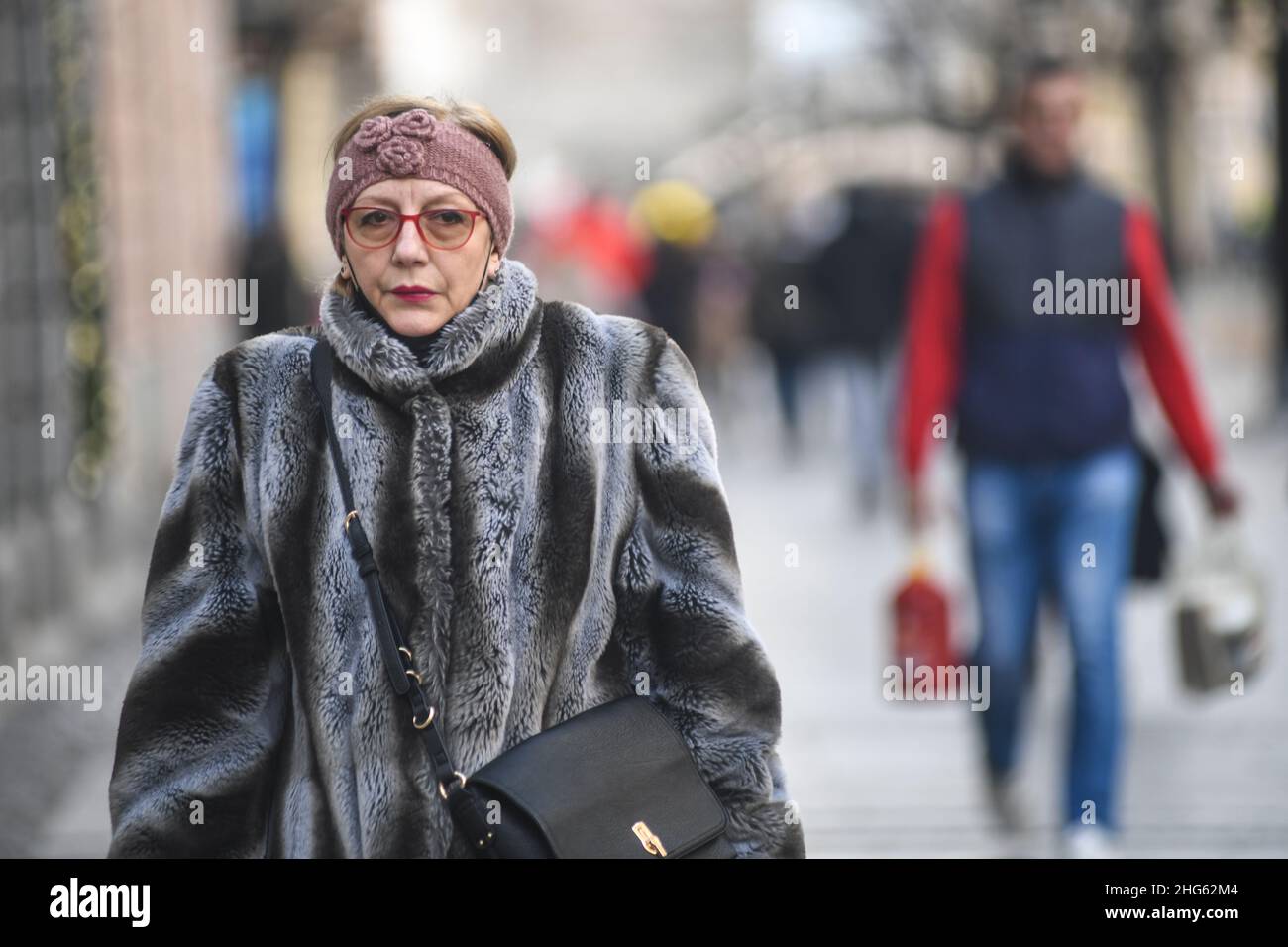 Senior lady in winter clothes, Knez Mihailova street. Belgrade, Serbia Stock Photo