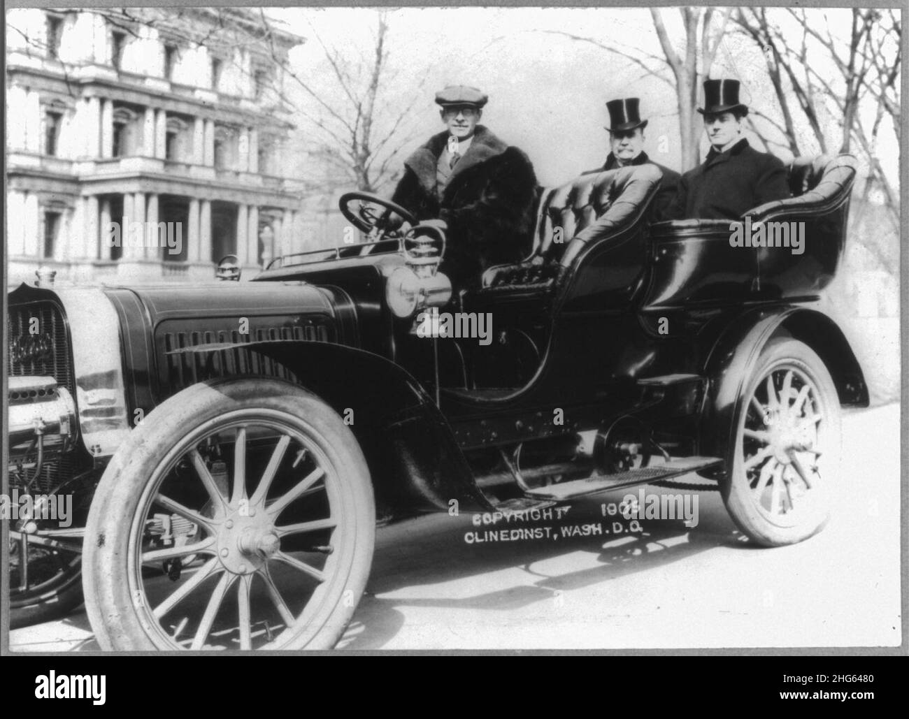 Senators Albert J. Beveridge and Albert Jarvis Hopkins in the back seat of a chauffeured automobile, with State, War and Navy building in background Stock Photo