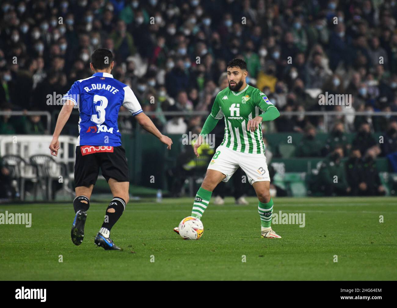 SEVILLE, SPAIN - JANUARY 18: Nabil Fekir #8 of Real Betis drives the ball during the La Liga match between Real Betis and Alavés at Benito Villamarín Stadium on January 18, 2022 in Seville, Spain. (Photo by Sara Aribó/PxImages) Stock Photo