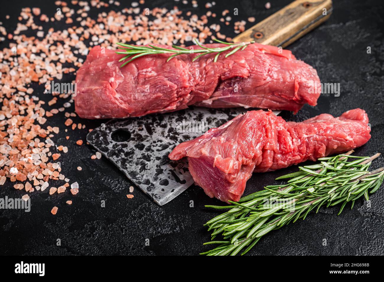 Whole Beef tenderloin meat, raw tender loin on butcher table. Black ...