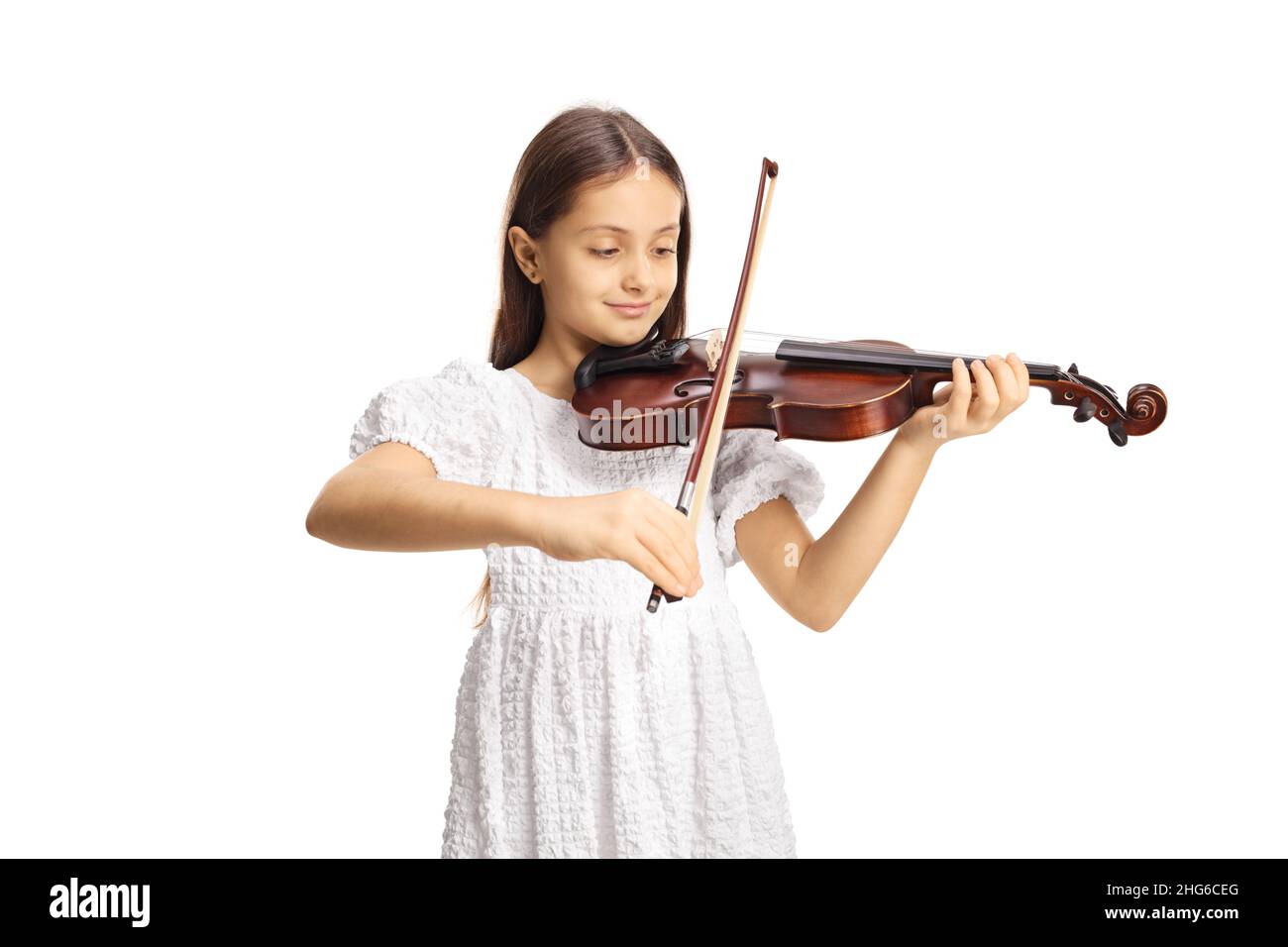 Smiling girl in a white dress playing a violin isolated on white ...