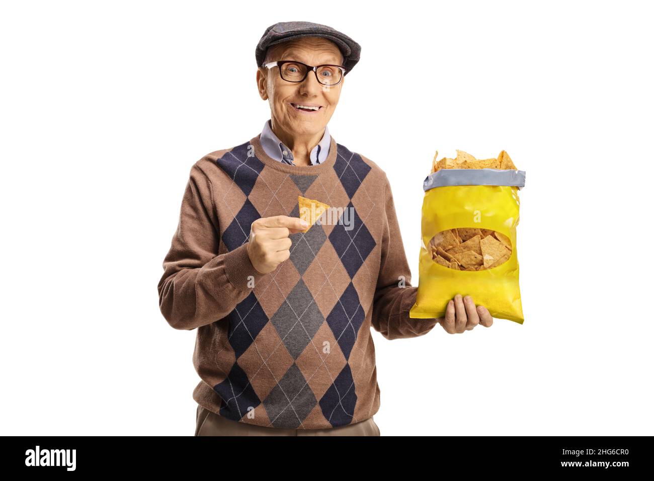 Elderly man holding a pack of tortilla chips isolated on white background Stock Photo