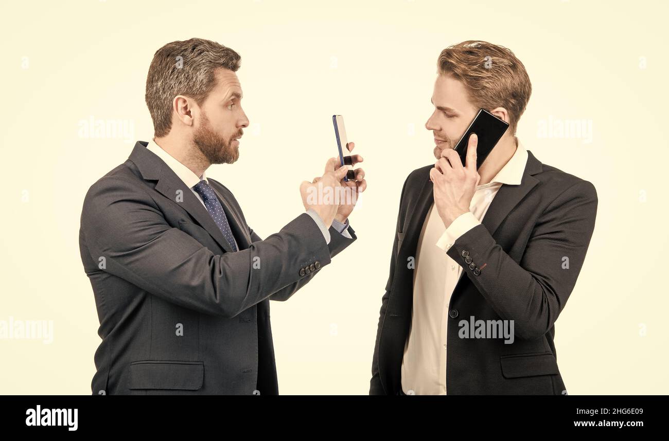 Constant connectivity. Businessmen use smartphones. Mobile communication. Mobile device management Stock Photo