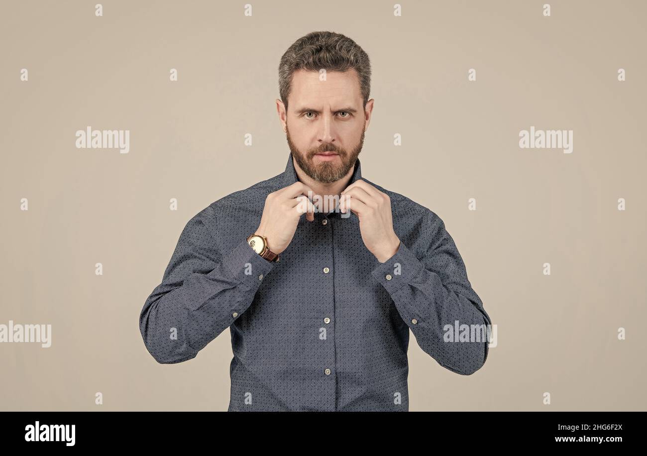 Unshaven man button casual shirt grey background, informal Stock Photo