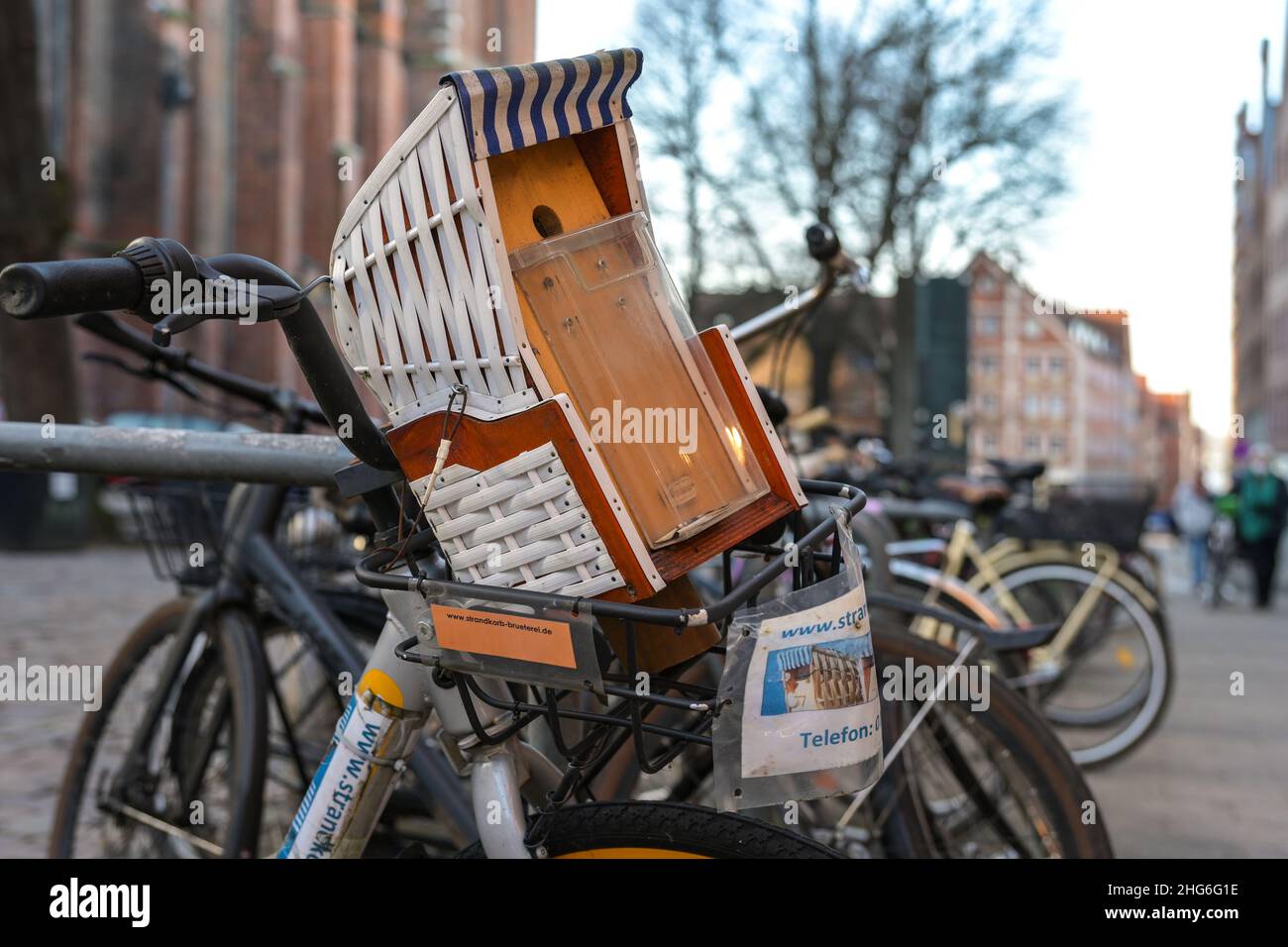 Lubeck, Germany, January 15, 2022: Bird nesting house in the shape of a typical north german beach basket chair with place for flyers, attached to a b Stock Photo