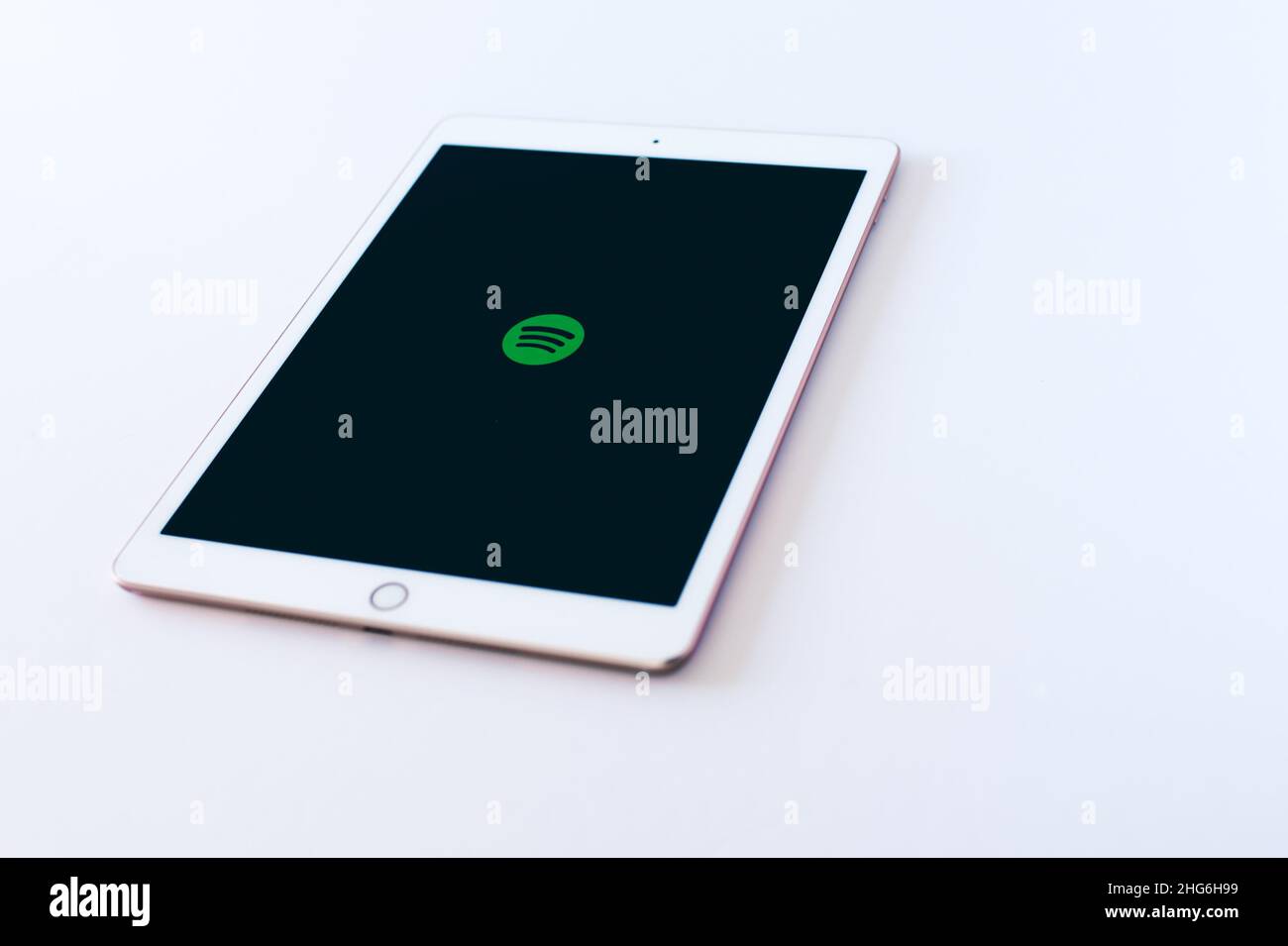 Barcelona, 2022: Tablet with Spotify logo on an empty background. Social networks and technology. Copy space Stock Photo