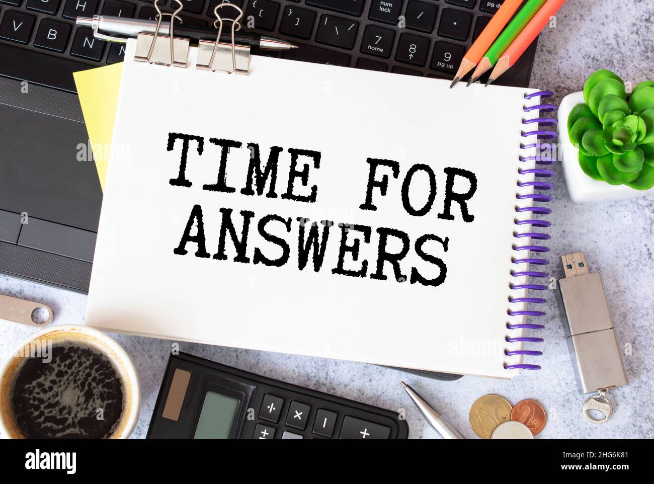 On a pink background, pen and notebook with the text TIME FOR ANSWERS ...