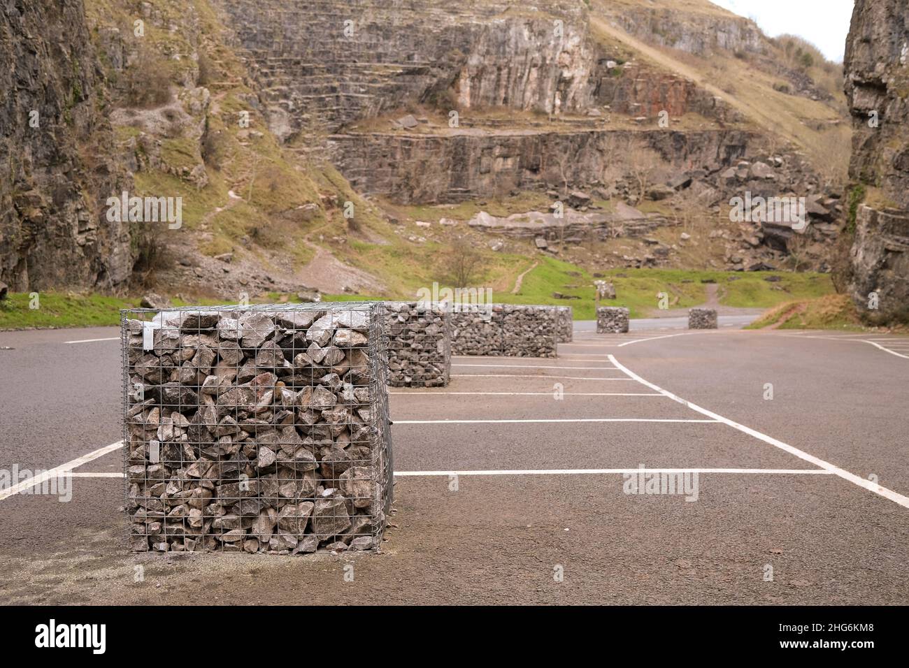 January 2022 - Gabion's placed in the car parks of gorge in Cheddar, Somerset, England, UK. to  limit the numbers of drivers with their reckless ways Stock Photo
