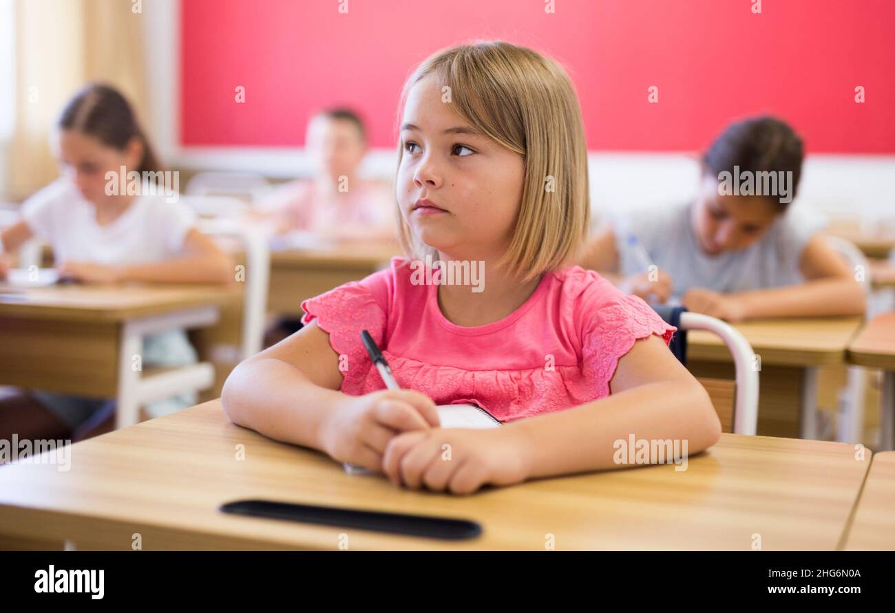 Schoolgirl in classroom Stock Photo - Alamy