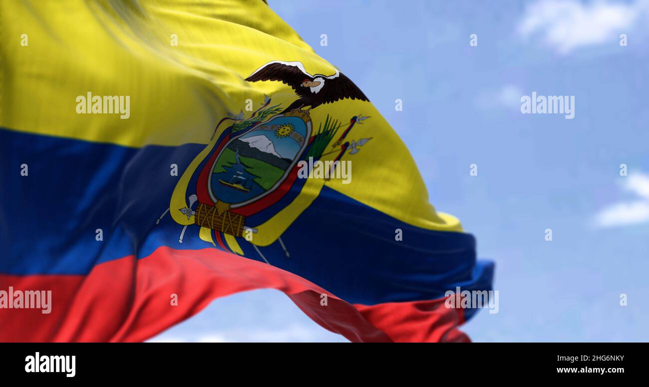 Detailed close up of the national flag of Ecuador waving in the wind on a clear day. Democracy and politics. South American country. Selective focus. Stock Photo