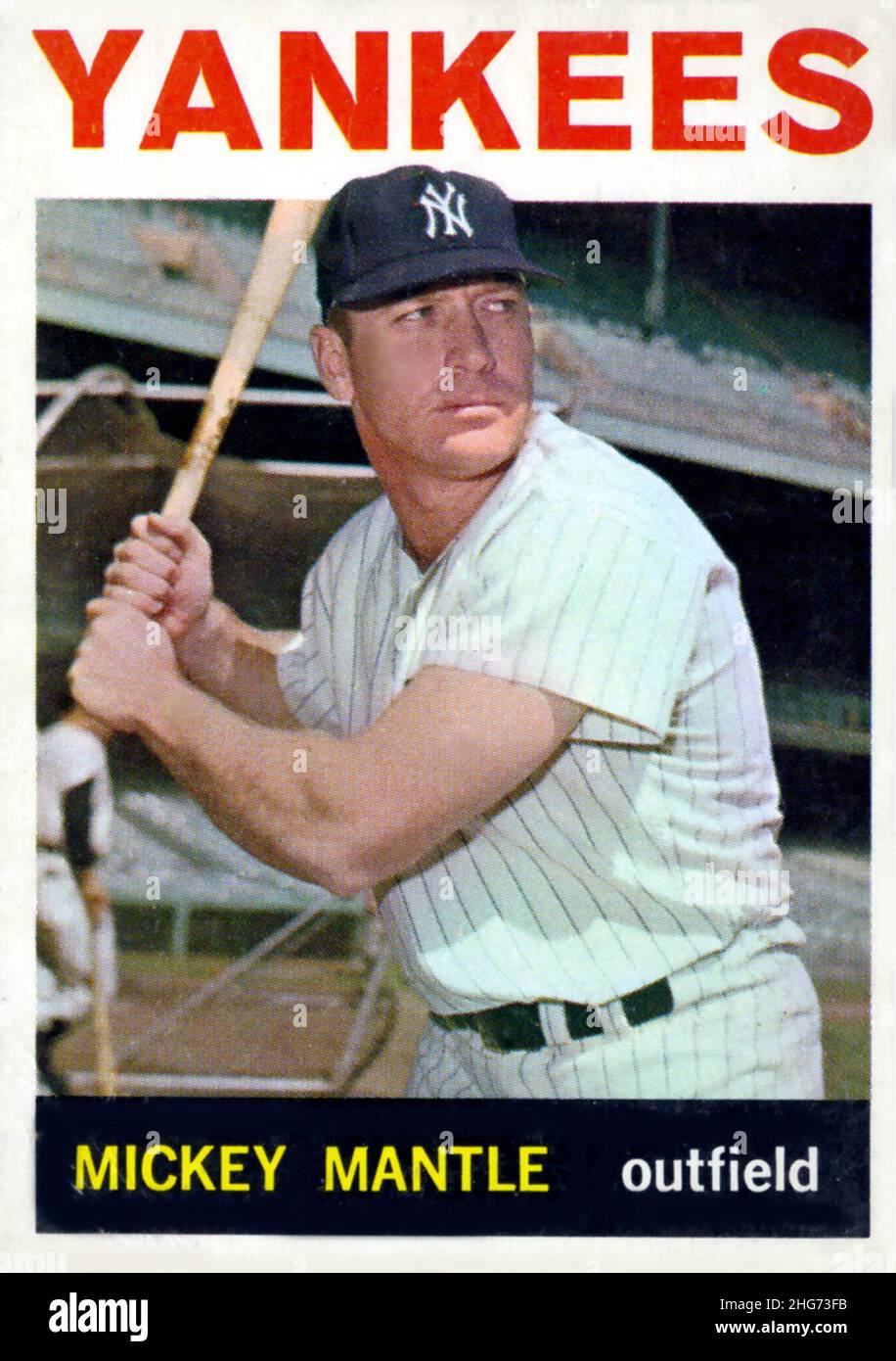 A 1964 Topps baseball card depicts Hall of Famer Mickey Mantle with the New York Yankees. Stock Photo