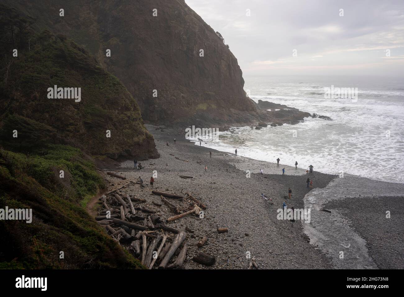 Visitors to the north Oregon Coast went rockhounding on the Short Beach on Sunday, January 16, 2022. Pacific tsunami threat triggered by a massive... Stock Photo
