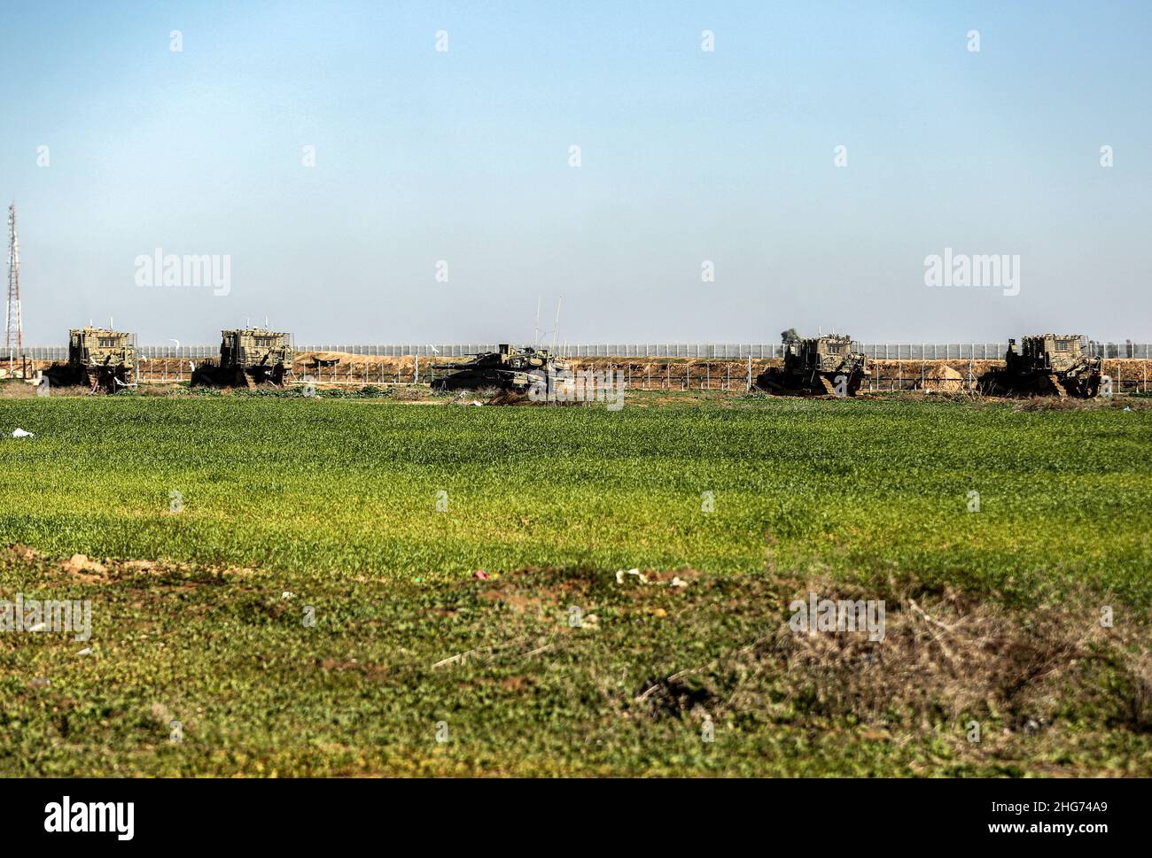 Gaza, Palestine. 18th Jan, 2022. Israeli military vehicles are seen moving inside the Palestinian territories on the border strip in the town of Khuza'a, east of Khan Yunis in the southern Gaza Strip. (Photo by Yousef Masoud/SOPA Images/Sipa USA) Credit: Sipa USA/Alamy Live News Stock Photo