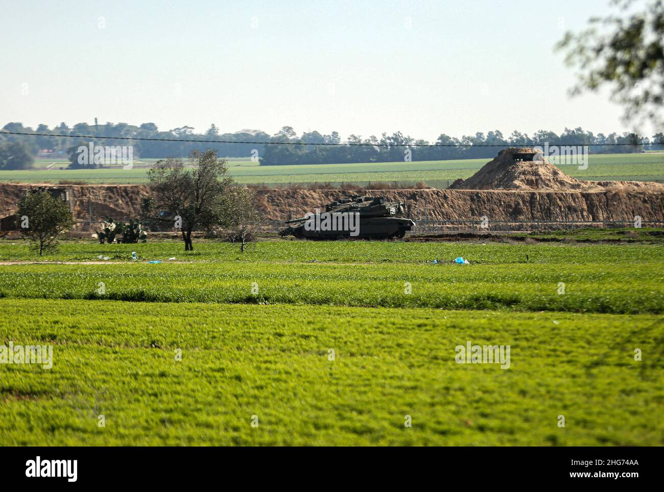 Gaza, Palestine. 18th Jan, 2022. An Israeli military tank was seen driving inside the Palestinian territories at the border in Khuza'a, east of Khan Yunis, south of the Gaza Strip. (Photo by Yousef Masoud/SOPA Images/Sipa USA) Credit: Sipa USA/Alamy Live News Stock Photo