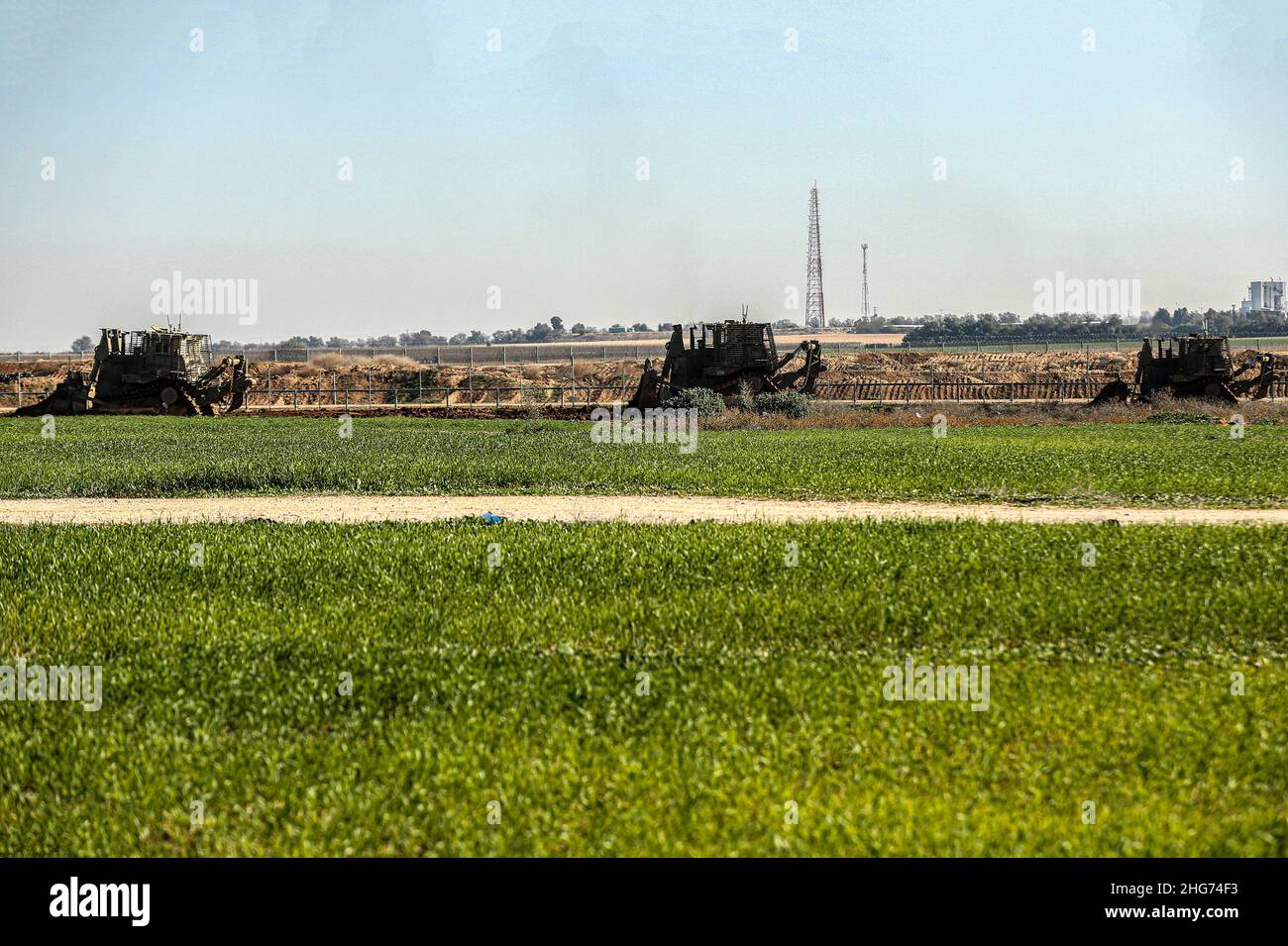 Gaza, Palestine. 18th Jan, 2022. Israeli military vehicles are seen moving inside the Palestinian territories on the border strip in the town of Khuza'a, east of Khan Yunis in the southern Gaza Strip. (Photo by Yousef Masoud/SOPA Images/Sipa USA) Credit: Sipa USA/Alamy Live News Stock Photo