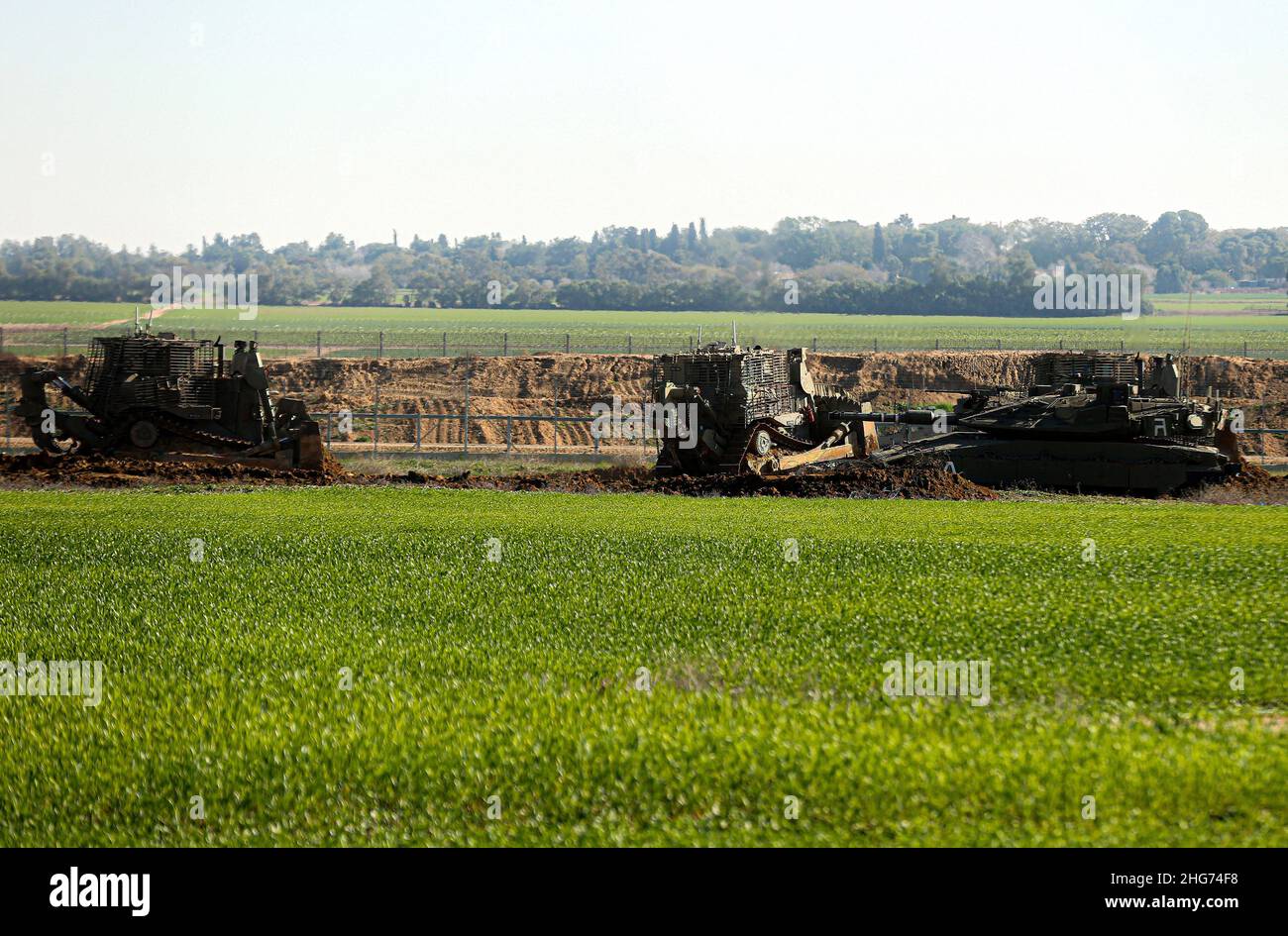 Gaza, Palestine. 18th Jan, 2022. Israeli army bulldozers razing Palestinian agricultural land in Khuza'a, east of Khan Yunis, in the southern Gaza Strip. (Photo by Yousef Masoud/SOPA Images/Sipa USA) Credit: Sipa USA/Alamy Live News Stock Photo